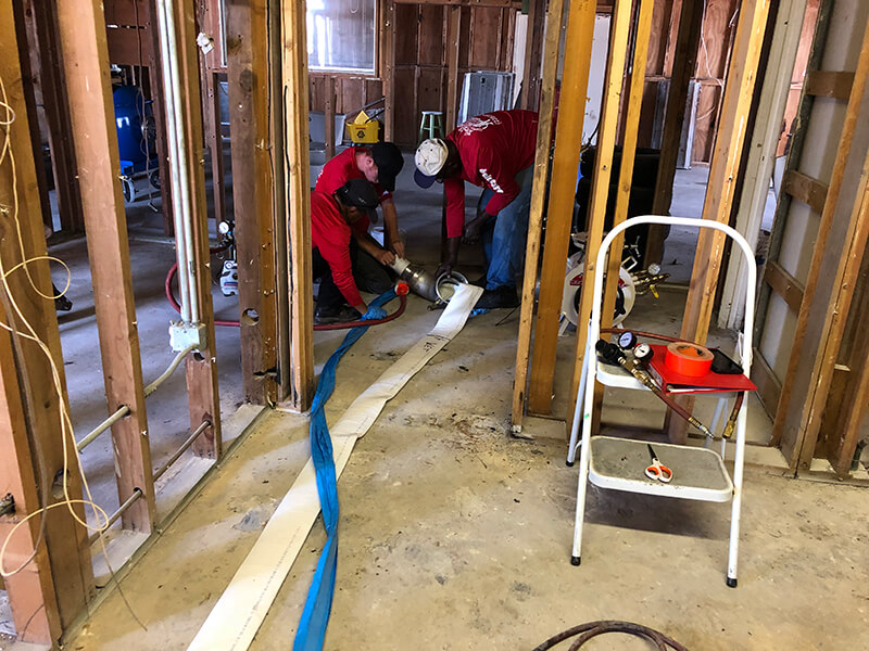 The Plumber's Plumber Employees Working on Pipe Lining