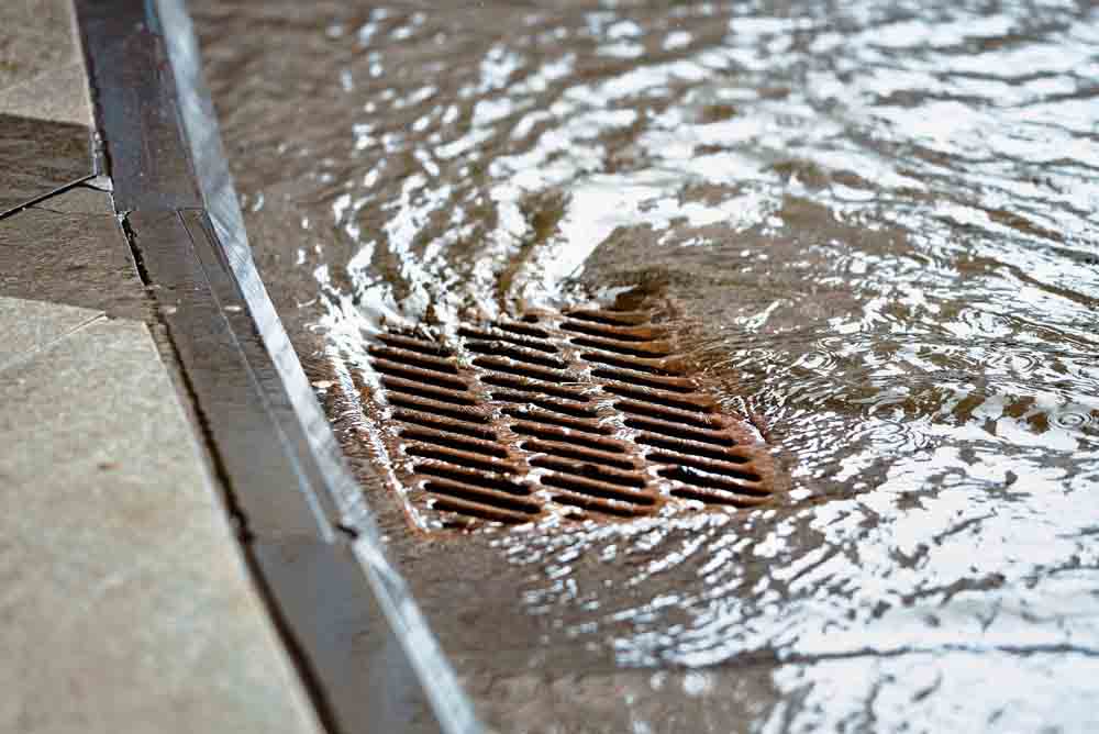 water going down a storm drain