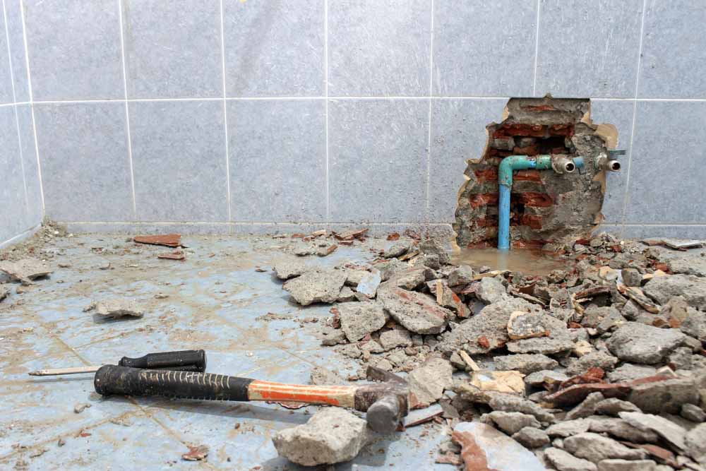 leak from a pipe leaving rubble on the floor