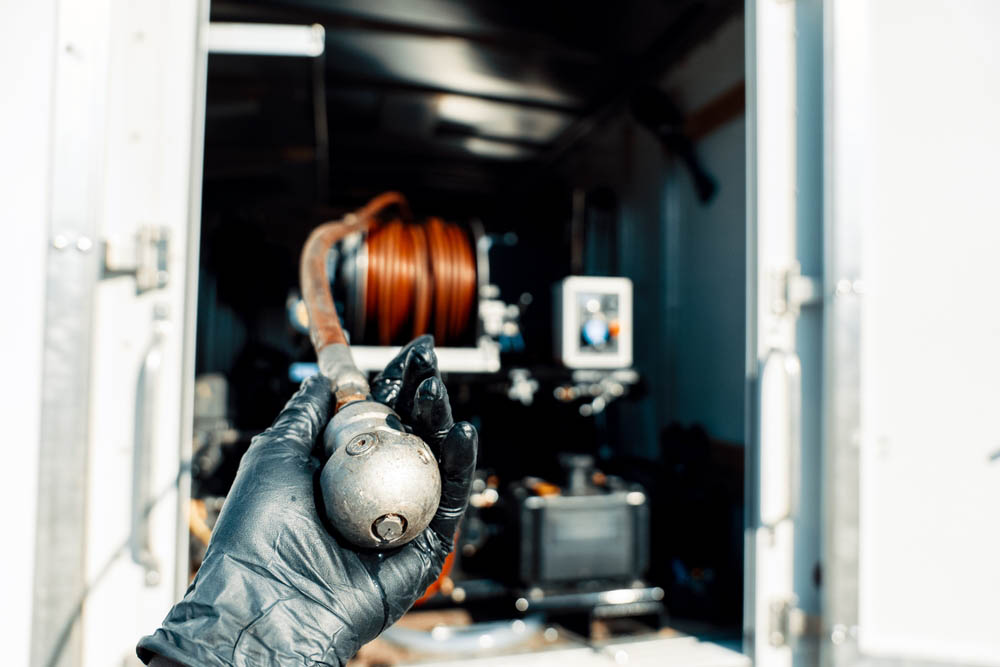 technician preparing hydro jetting equipment