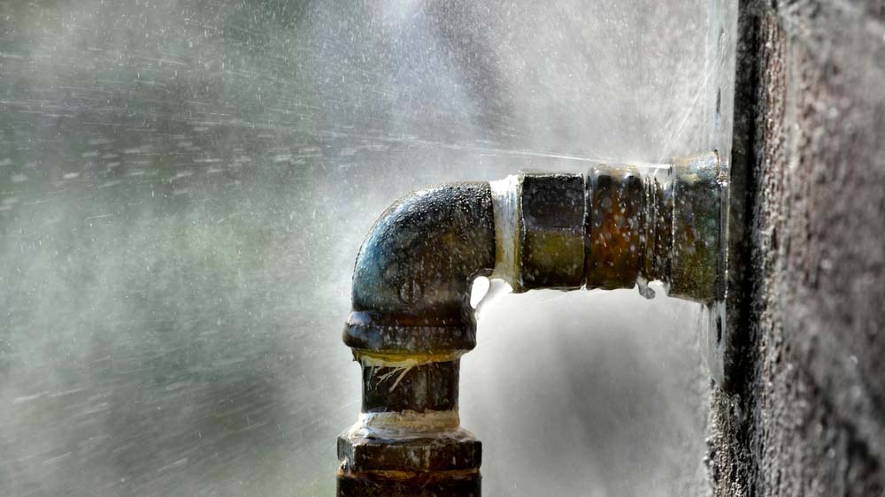 water surging from burst pipe Fort Myers, FL